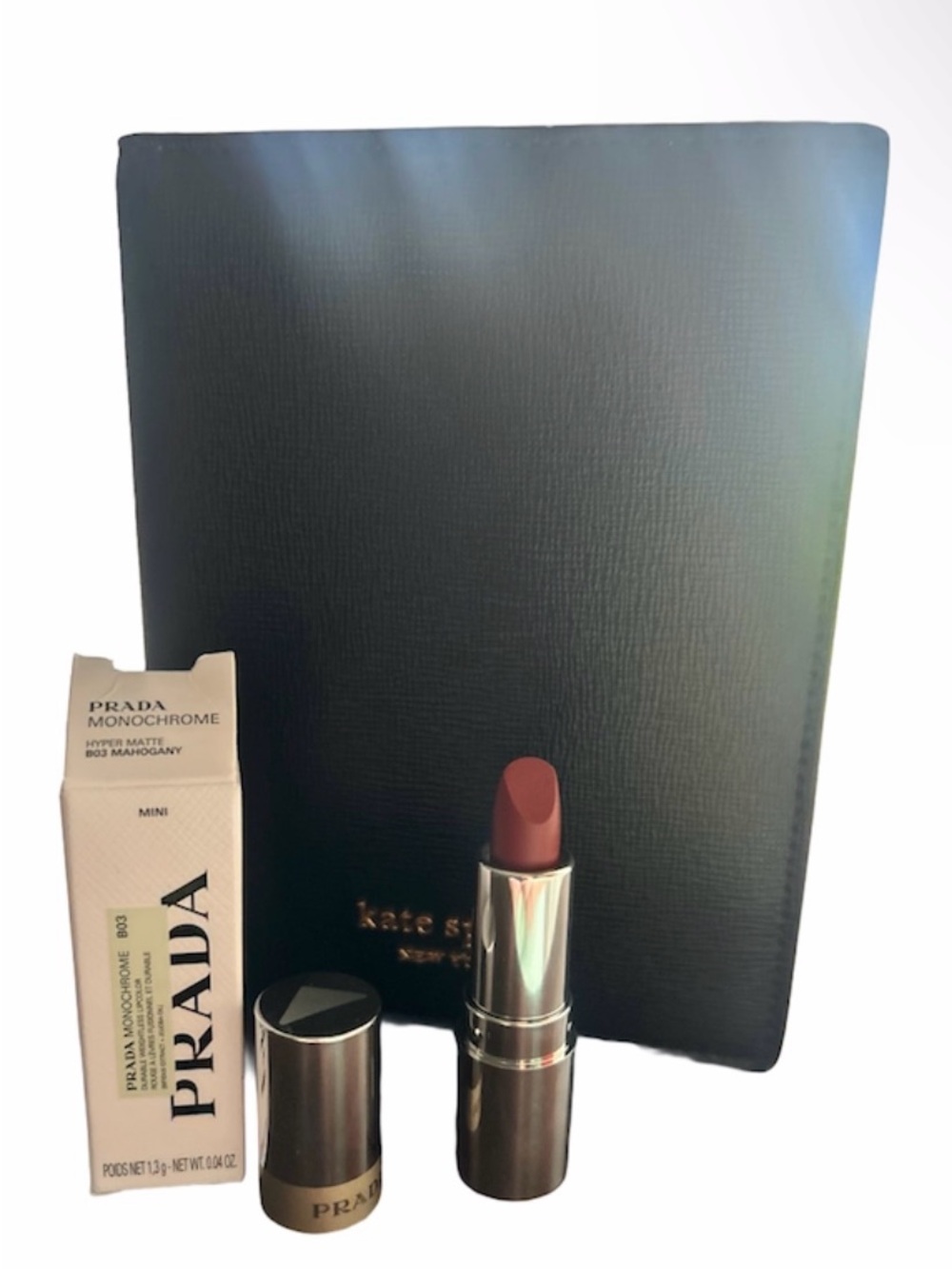 Kate Spade Passport Holder and Prada Mini Lipstick in Mahogany